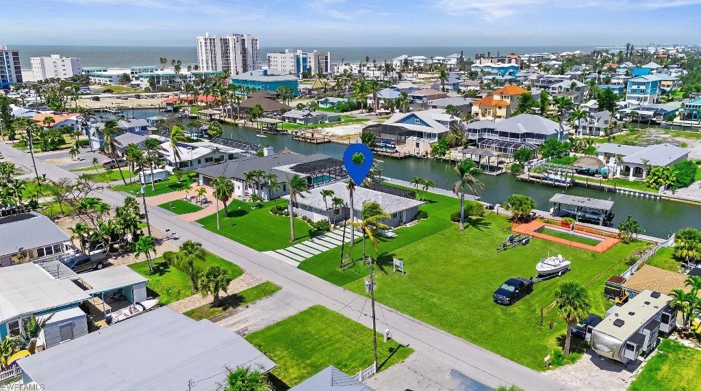 Estero Escape waterfront estate aerial view with canal access Fort Myers Florida