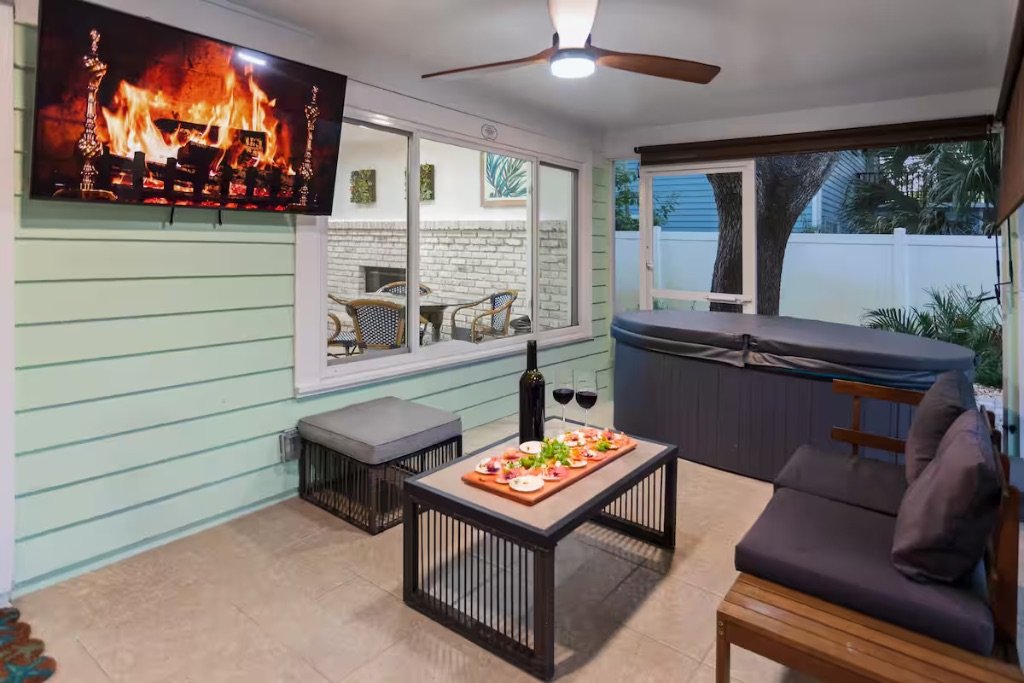 Vero Oaks screened patio with hot tub outdoor seating and entertainment area