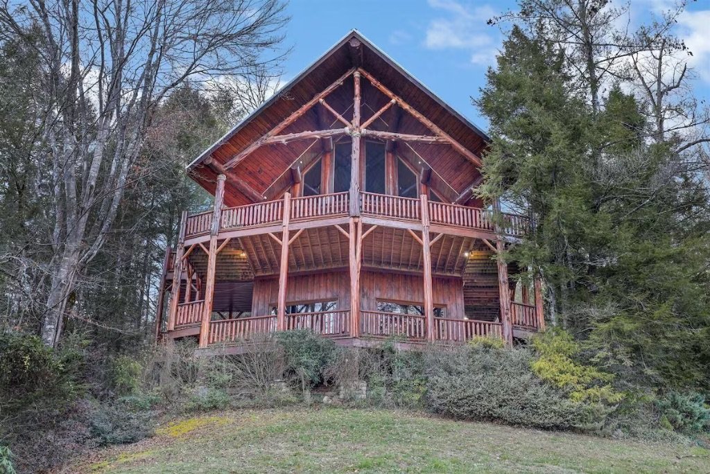 Waters Edge Lodge exterior with wraparound decks and mountain setting at Cedar Falls Resort